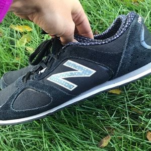 Black New Balance 555 sneakers